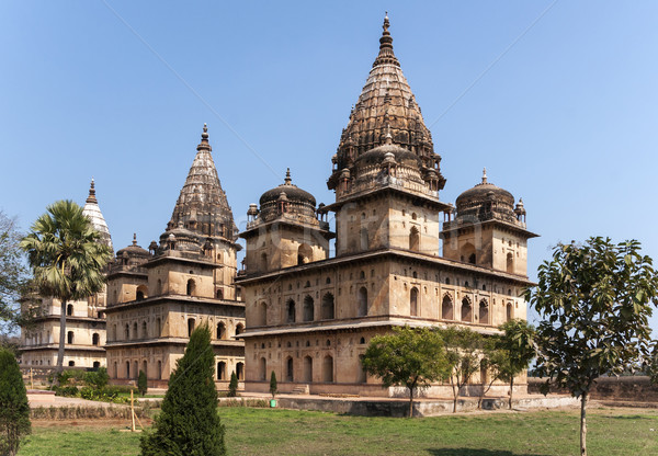 Group of three square Bundela Cenotaphs in park of India's Orchha. Stock photo © Klodien