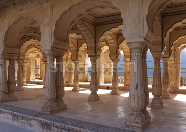 Gallery of rimmed pillars in light sunshine at Jaipur's Amber Fort. Stock photo © Klodien