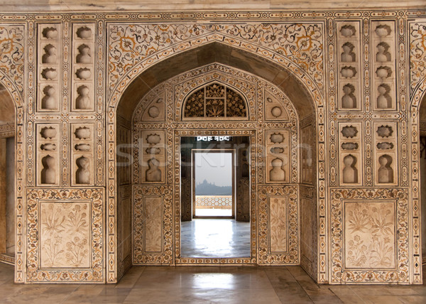 Decorated marble wall frames gate and door at Agra Fort Palace i Stock photo © Klodien