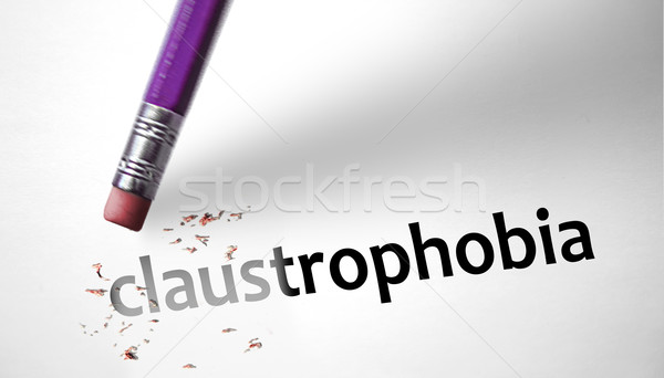Eraser deleting the word Claustrophobia  Stock photo © klublu
