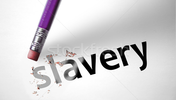 Eraser deleting the word Slavery  Stock photo © klublu