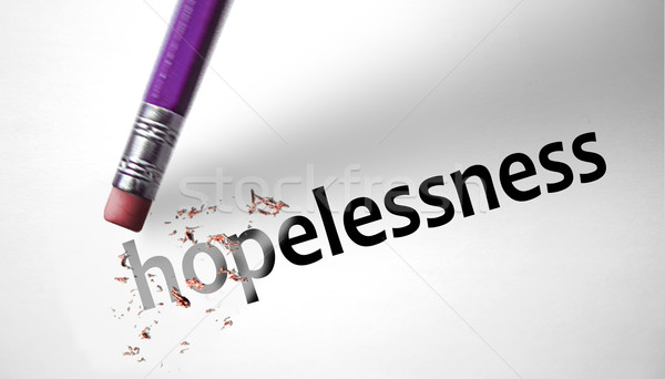 Eraser deleting the word Hopelessness  Stock photo © klublu