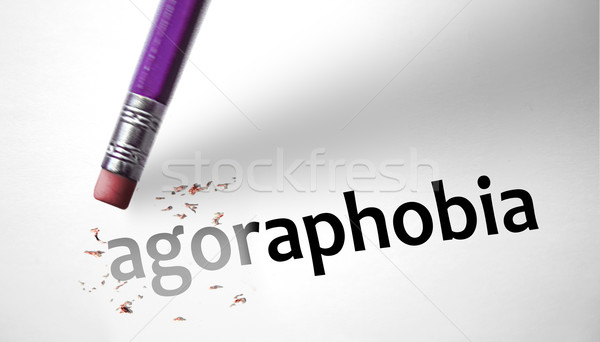 Eraser deleting the word Agoraphobia  Stock photo © klublu