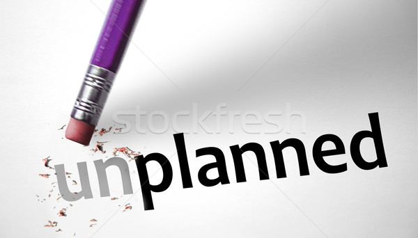 Eraser changing the word Unplanned for Planned  Stock photo © klublu