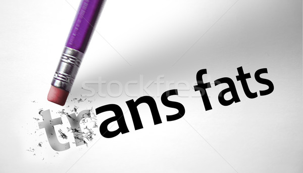 Stock photo: Eraser deleting the concept Trans Fats