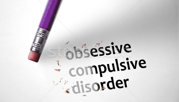 Stock photo: Eraser deleting the concept Obsessive Compulsive Disorder, OCD. 