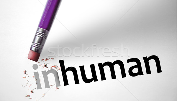 Eraser changing the word Inhuman for human  Stock photo © klublu