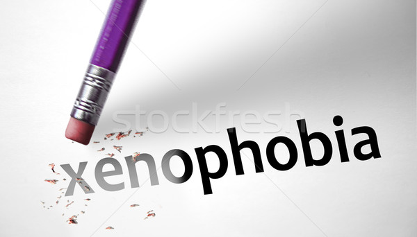 Eraser deleting the word Xenophobia Stock photo © klublu