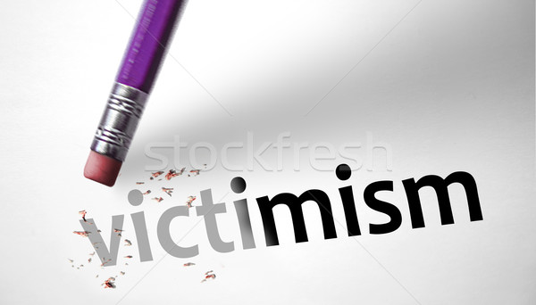 Eraser deleting the word Victimism  Stock photo © klublu