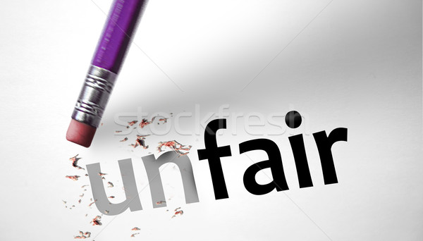 Stock photo: Eraser changing the word unfair for fair 