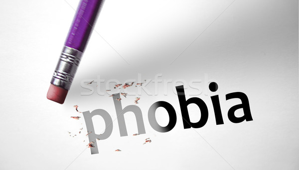 Stock photo: Eraser deleting the word Phobia