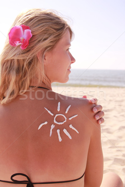 Stock photo: sun cream on the female back on the beach