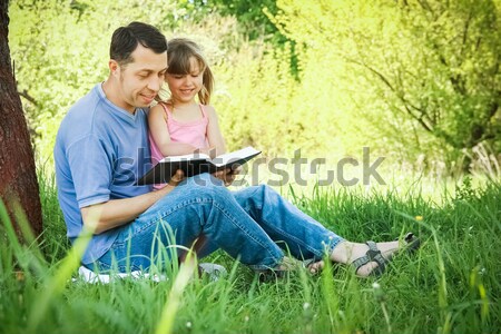 father with his little daughter reads the Bible Stock photo © koca777