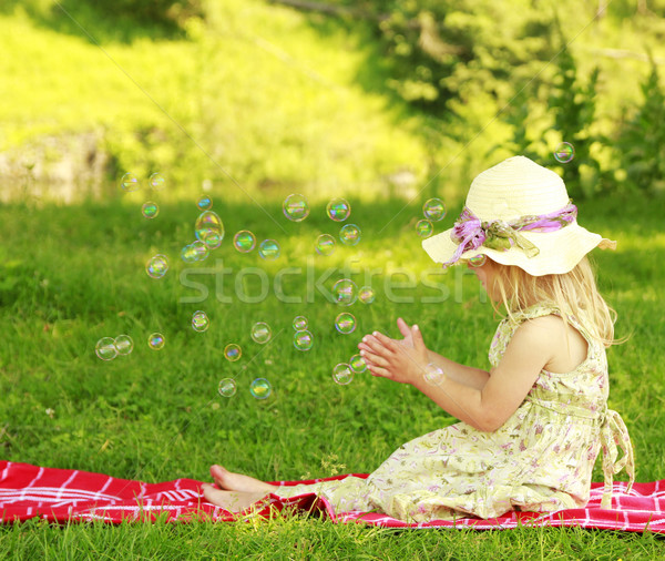little girl with soap bubbles Stock photo © koca777