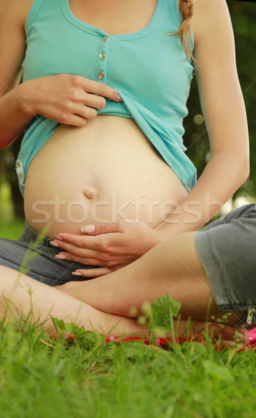 beautiful young pregnant girl on nature Stock photo © koca777
