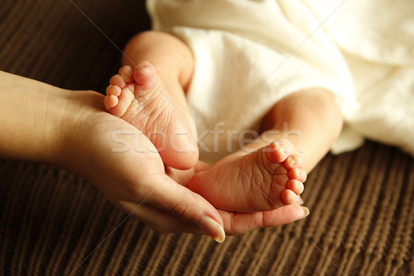legs one cute newborn little baby in mother's hands  Stock photo © koca777