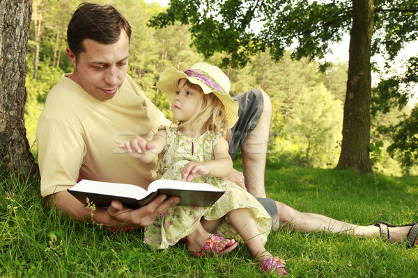 young father with his little daughter reads the Bible  Stock photo © koca777