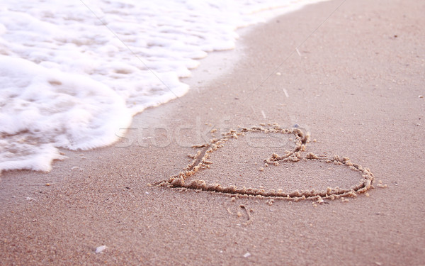 Stock photo: heart in the sand on the seashore 