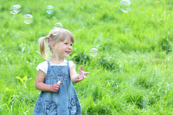 little girl with soap bubbles Stock photo © koca777