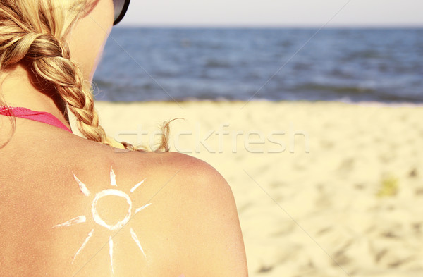 Soleil crème Homme Retour plage femme Photo stock © koca777
