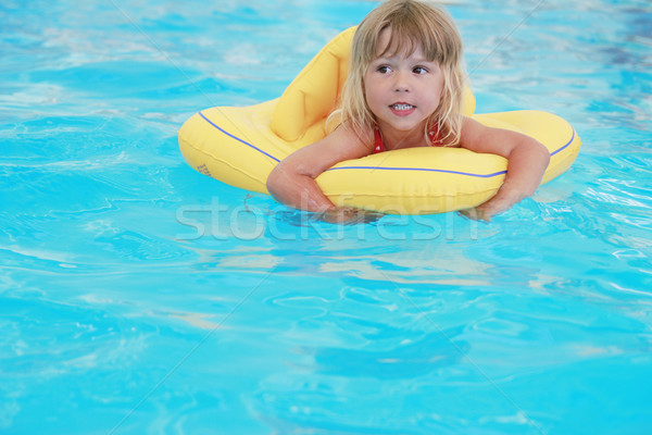 girl swims in a pool with a circle Stock photo © koca777