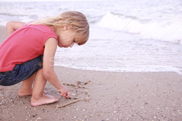 Petite fille soleil sable plage famille fille [[stock_photo]] © koca777