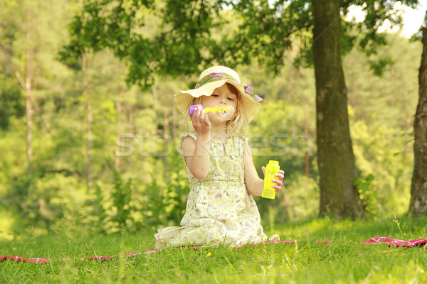 little girl with soap bubbles Stock photo © koca777