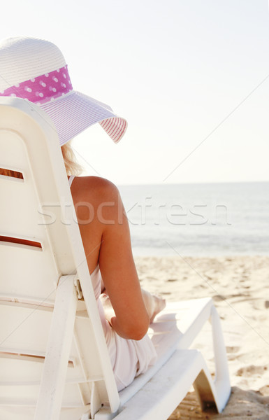 Nina sombrero cubierta silla playa agua Foto stock © koca777