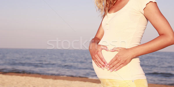 Femme enceinte plage femme eau mains amour [[stock_photo]] © koca777