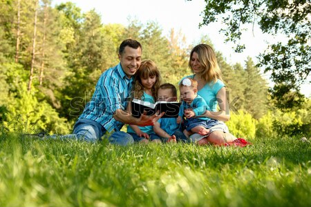 family with a young daughter reads the Bible Stock photo © koca777