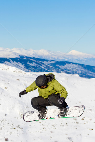 Snowbordos ugrik fiú snowboard férfi hó Stock fotó © kokimk