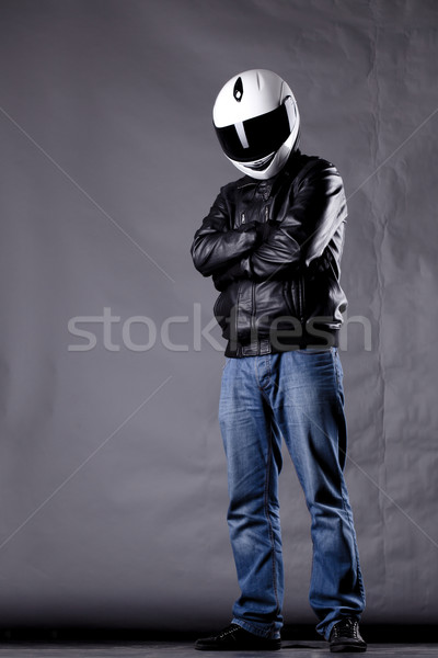 Stock photo: motorist with a helmet, leather jacket and jeans