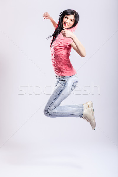 çekici genç kız atlama pembe kadın Stok fotoğraf © kokimk