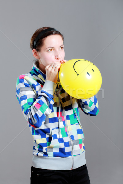 girl inflating a balloon Stock photo © kokimk