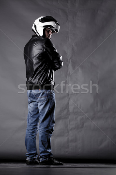 motorist with a helmet, leather jacket and jeans Stock photo © kokimk