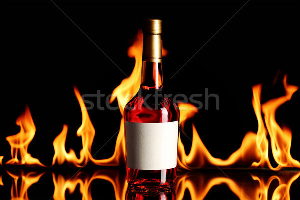 Vino brandy fuego botella llamas diseno Foto stock © kokimk