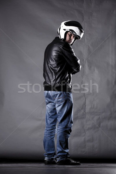 Stock photo: motorist with a helmet, leather jacket and jeans