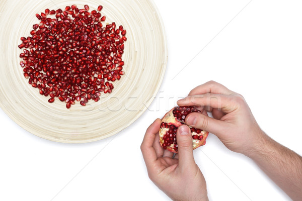 Completo prato descascado romã sementes homem Foto stock © koldunov