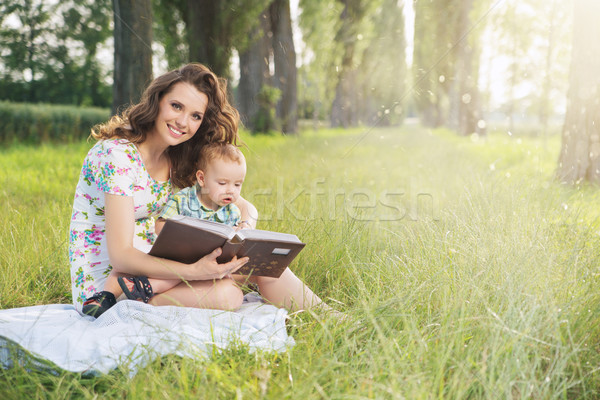 Charming mother spending spare time with her son Stock photo © konradbak