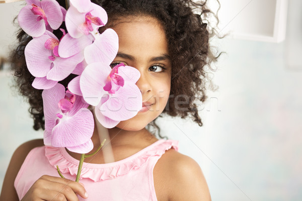Little girl holding a beautiful flower Stock photo © konradbak
