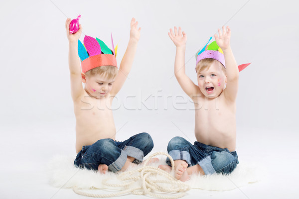 Funny picture of two boys playing Indians Stock photo © konradbak