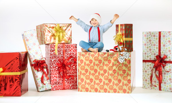 Small cute boy on plenty of presents Stock photo © konradbak