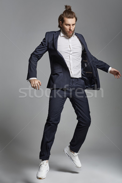 Portrait of an attractive guy wearing sports suit Stock photo © konradbak