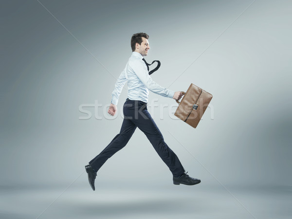 Portret springen manager bankier glimlach man Stockfoto © konradbak