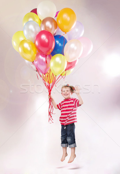 Cute small kid hovering by the ballons Stock photo © konradbak