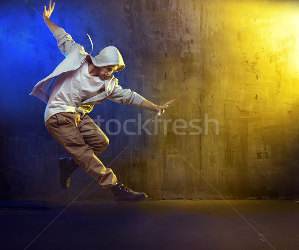 Athletic guy dancing a hip hop Stock photo © konradbak