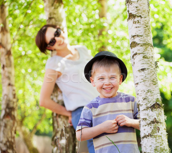 Smiling kid and his mom in the background Stock photo © konradbak