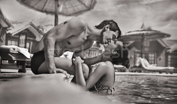 élégant couple piscine eau homme été Photo stock © konradbak