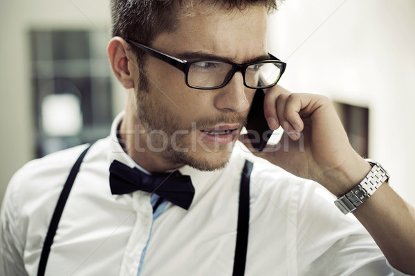 Closeup portrait of a phoning man Stock photo © konradbak