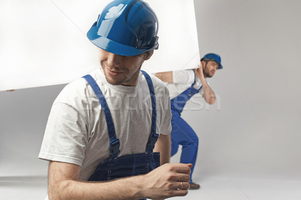 Hard-working builders during the renovation Stock photo © konradbak